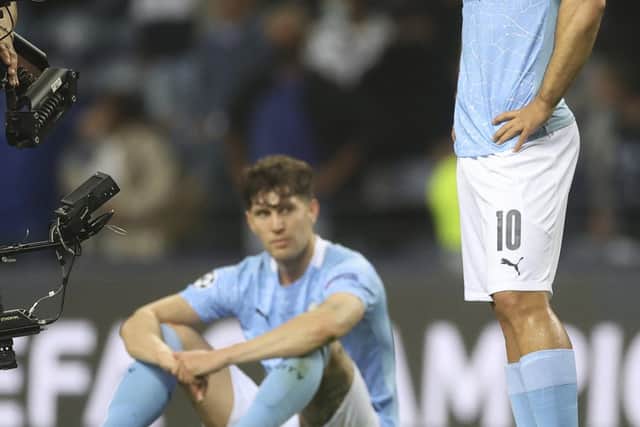 Manchester City's Sergio Aguero grimaces at the end of the Champions League final soccer match between Manchester City and Chelsea at the Dragao Stadium in Porto, Portugal, Saturday, May 29, 2021. (Carl Recine/Pool via AP)