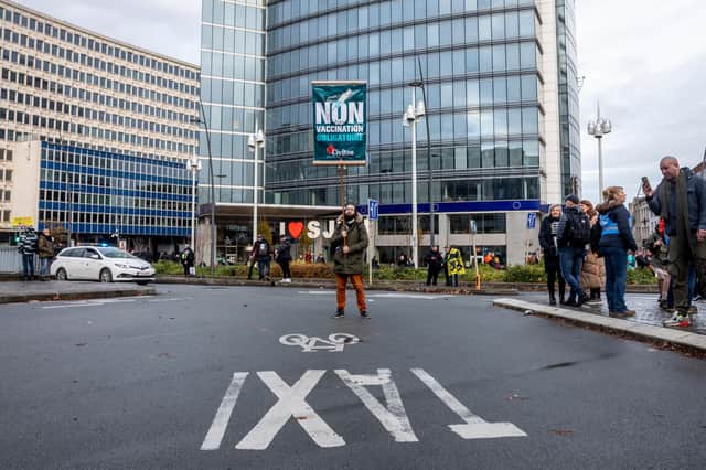A man protests around the latest coronavirus measures in Brussels yesterday (Photo: Getty Images)