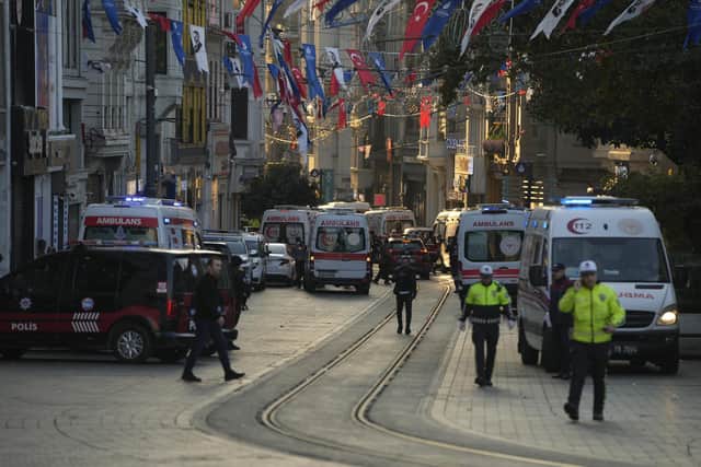 Security and ambulances at the scene after an explosion on Istanbul's popular pedestrian Istiklal Avenue. Picture: AP Photo/Francisco Seco