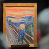 People view the Norwegian artist Edvard Munch's 'The Scream' at Sotheby's auction house in central London in April 2012 (Photo: CARL COURT/AFP via Getty Images)