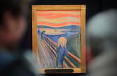 People view the Norwegian artist Edvard Munch's 'The Scream' at Sotheby's auction house in central London in April 2012 (Photo: CARL COURT/AFP via Getty Images)