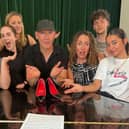 Whole cast, and center, producer Frank Scarito with the original £1,000 shoes