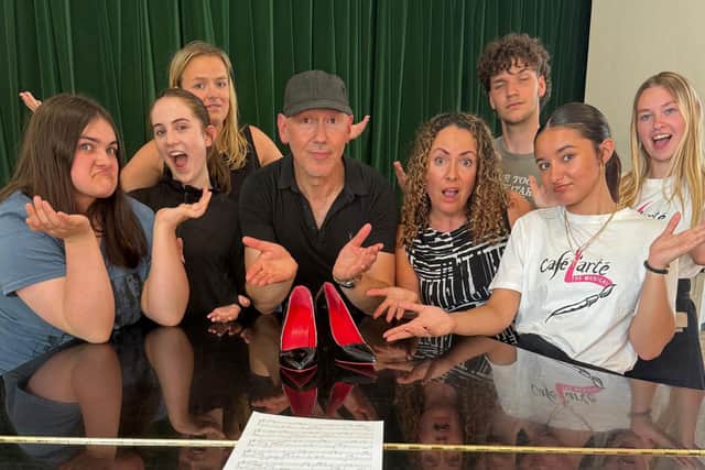 Whole cast, and center, producer Frank Scarito with the original £1,000 shoes