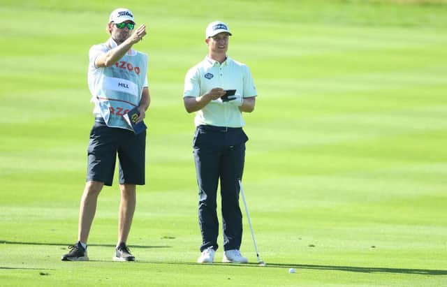 Calum Hill chats to his caddie during the third round of the Cazoo Classic at the London Golf Club in West Kingsdown. Picture: Andrew Redington/Getty Images.
