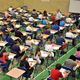 Pupils sitting an exam. Ben Birchall/PA Wire