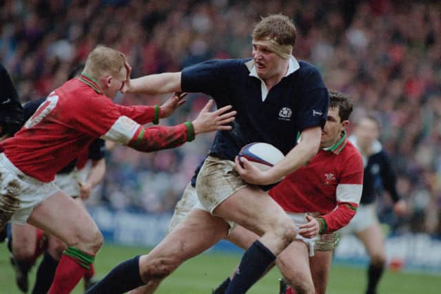 Doddie Weir (centre) of Scotland, hands off Neil Jenkins of Wales during a Five Nations Championship match at Murrayfield Stadium, Edinburgh, Scotland, 4th March 1995. Scotland won the match 26-13. (Photo by David Rogers/Getty Images)