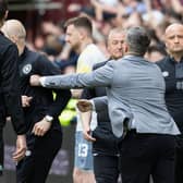 Hibs manager Lee Johnson and Hearts interim coach Steven Naismith clash on the touchline after the final whistle.