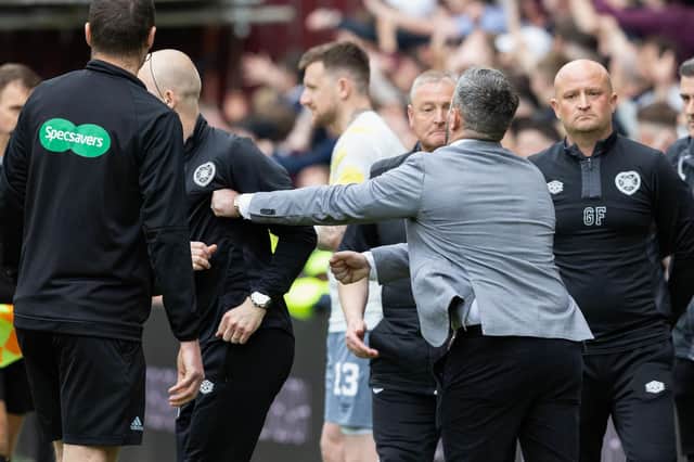 Hibs manager Lee Johnson and Hearts interim coach Steven Naismith clash on the touchline after the final whistle.