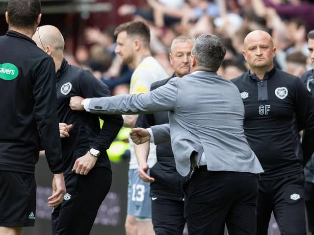Hibs manager Lee Johnson and Hearts interim coach Steven Naismith clash on the touchline after the final whistle.