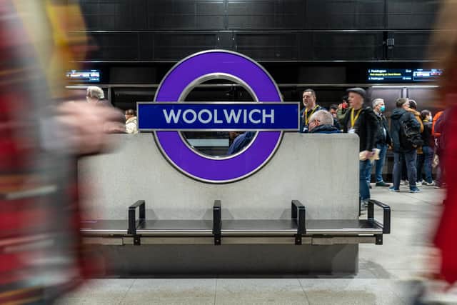Volunteers acting as passengers pass one of the Merson Group's station roundels during an Elizabeth line train test run in March. Picture: Niklas Halle'n/AFP/Getty Images