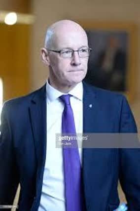 John Swinney has said that pupils could be failed by the SQA despite a teacher's pass.