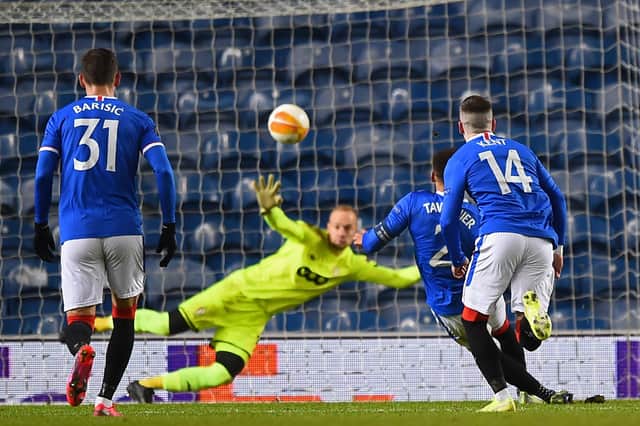 James Tavernier scores Rangers' second goal from the penalty spot during the UEFA Europa League 1st round Group D match between Rangers and Standard Liege at Ibrox. (Photo by ANDY BUCHANAN / POOL / AFP)