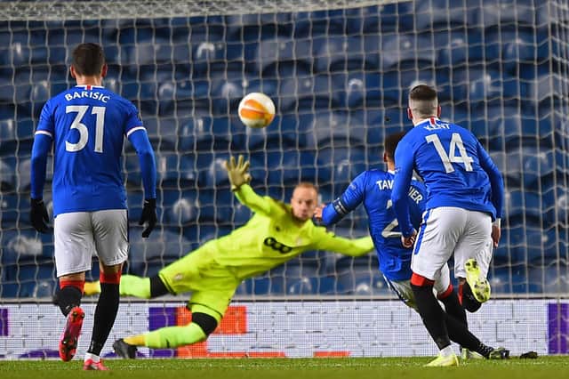 James Tavernier scores Rangers' second goal from the penalty spot during the UEFA Europa League 1st round Group D  match between Rangers and Standard Liege at Ibrox. (Photo by ANDY BUCHANAN / POOL / AFP)