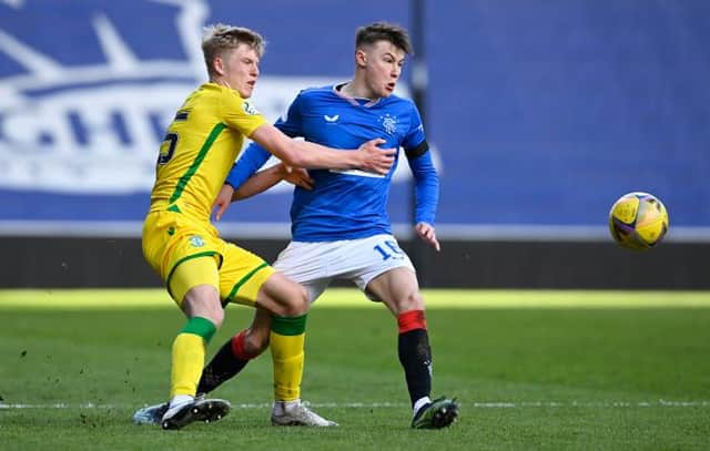 Hibernian left-back Josh Doig and Rangers right-back Nathan Patterson tussle during a match at Ibrox in April. Both have been shortlisted for the SFWA Young Player of the Year award. (Photo by Rob Casey / SNS Group)