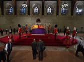 Members of the public file past the the coffin of Queen Elizabeth II, as they pay their respects as the vigil begins in Westminster Hall, London, where it will lie in state ahead of her funeral on Monday. Picture date: Wednesday September 14, 2022.