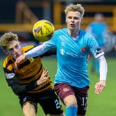 Hearts debutant Gary Mackay-Steven tussles with Alloa's Lucas Williamson.