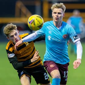 Hearts debutant Gary Mackay-Steven tussles with Alloa's Lucas Williamson.