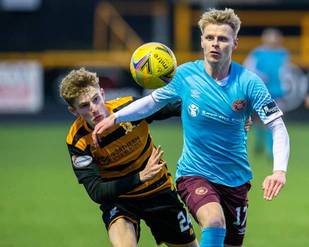 Hearts debutant Gary Mackay-Steven tussles with Alloa's Lucas Williamson.