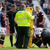 Liam Boyce is treated before being stretchered off in Hearts' 3-2 win over St St Johnstone. (Photo by Ross Parker / SNS Group)