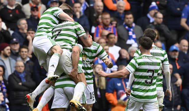 Celtic players celebrate Cameron Carter-Vickers' winner at Ibrox.  (Photo by Rob Casey / SNS Group)