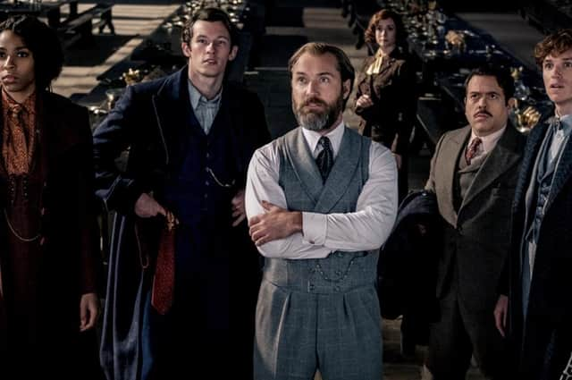 Jessica Williams, Callum Turner, Jude Law , Catherine Waterson, Dan Fogler and Eddie Redmayne in Fantastic Beasts: The Secrets of Dumbledore