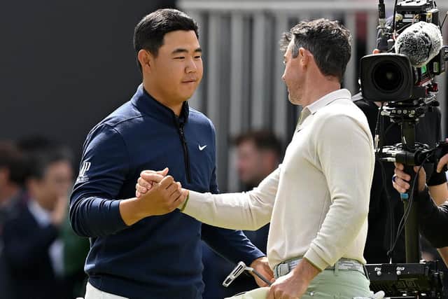 Tom Kim congratulates playing partner Rory McIlroy after the Northern Irishman finished birdie-birdie to win the 2023 Genesis Scottish Open. Picture: Octavio Passos/Getty Images.