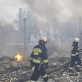 This handout picture released by the State Emergency Service of Ukraine on March 11, 2022, shows rescuers working at the scene of an airstrike in Dnipro.Photo by Handout / State Emergency Service of Ukraine / AFP