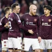 Hearts' Lawrence Shankland (L), Liam Boyce and Yutaro Oda celebrate the winning goal.