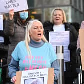 Mesh implant survivors protest for their rights to healthcare.