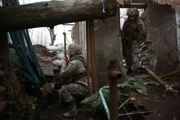 Ukrainian soldiers keep watch on the frontline with Russia-backed separatists, not far from town of Avdiivka, Donetsk, on Friday (Picture: Anatolii Stepanov/AFP via Getty Images)