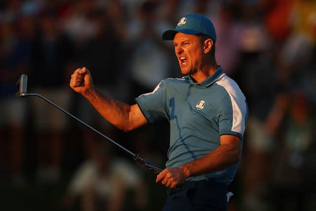 Justin Rose celebrates after holing a birdie putt on the 18th green to earn a half point in the final match to finish on the opening day in Rome. Picture: Naomi Baker/Getty Images.