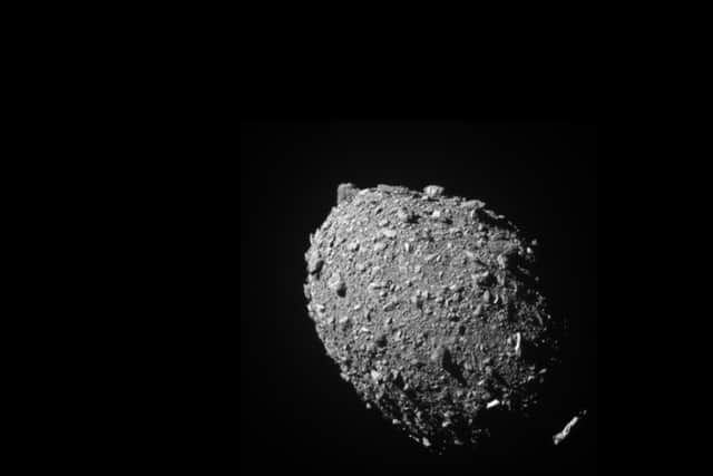 Handout photo issued by Nasa of asteroid moonlet Dimorphos as seen by the DART spacecraft 11 seconds before impact.