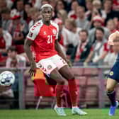 Denmark's Mohamed Daramy (L) fights for the ball with Scotland's Ryan Fraser. (Photo by MADS CLAUS RASMUSSEN/Ritzau Scanpix/AFP via Getty Images)