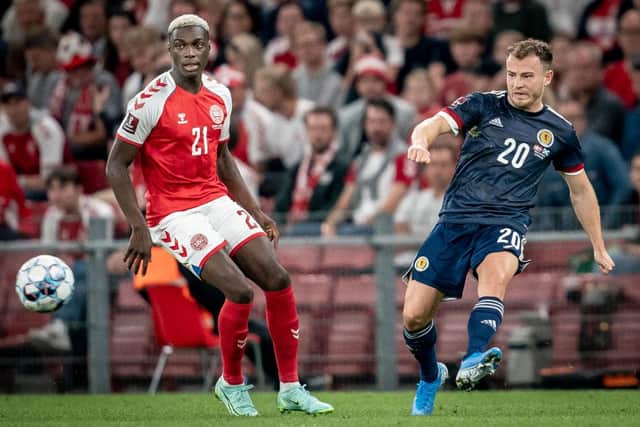 Denmark's Mohamed Daramy (L) fights for the ball with Scotland's Ryan Fraser. (Photo by MADS CLAUS RASMUSSEN/Ritzau Scanpix/AFP via Getty Images)