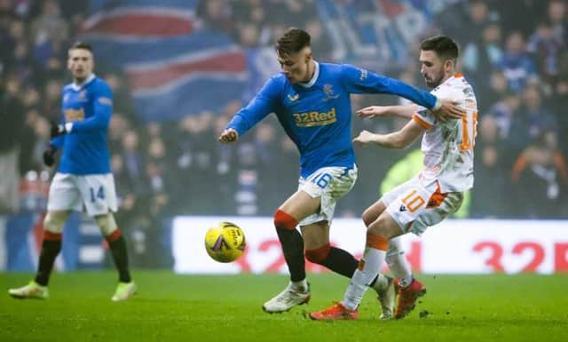 Nathan Patterson holds off a challenge from Dundee United striker Nicky Clark during Rangers' 1-0 win over the Tannadice side at Ibrox on Saturday. (Photo by Alan Harvey / SNS Group)