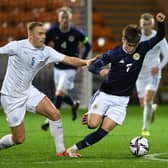 Scotland's Ben Doak tries to get away from Iceland's Olafur Gudmundsson during the Under-21 friendly at Fir Park.  (Photo by Ross MacDonald / SNS Group)