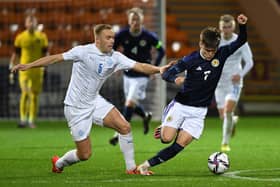 Scotland's Ben Doak tries to get away from Iceland's Olafur Gudmundsson during the Under-21 friendly at Fir Park.  (Photo by Ross MacDonald / SNS Group)