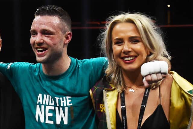 Josh Taylor celebrates his win over Ivan Baranchyk in 2019 with fiancee Danielle Murphy.
