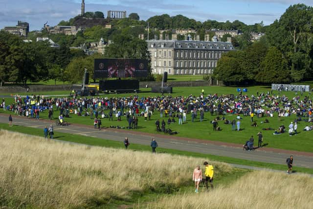 Crowds watch the funeral of Queen Elizabeth II from Holyrood Park. Picture: Lisa Ferguson