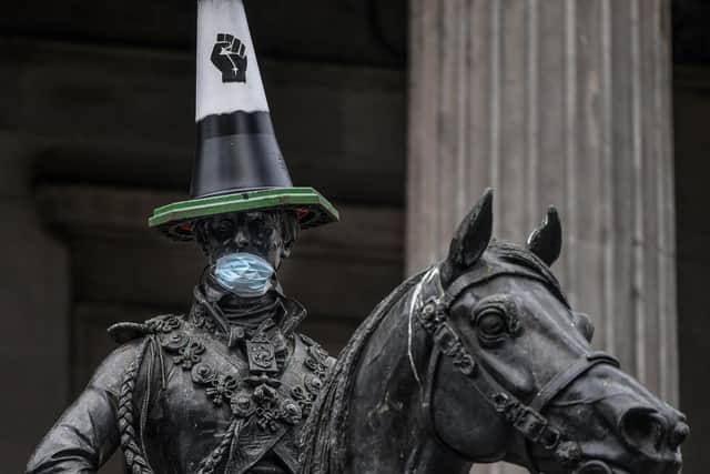 A Black Lives Matter cone is placed on the Duke of Wellington statue in Glasgow. Picture: Jeff J Mitchell/Getty Images