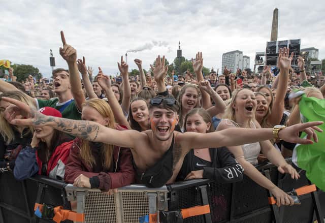 Revellers watching Dermot Kennedy performing at the TRNSMT Festival at Glasgow Green