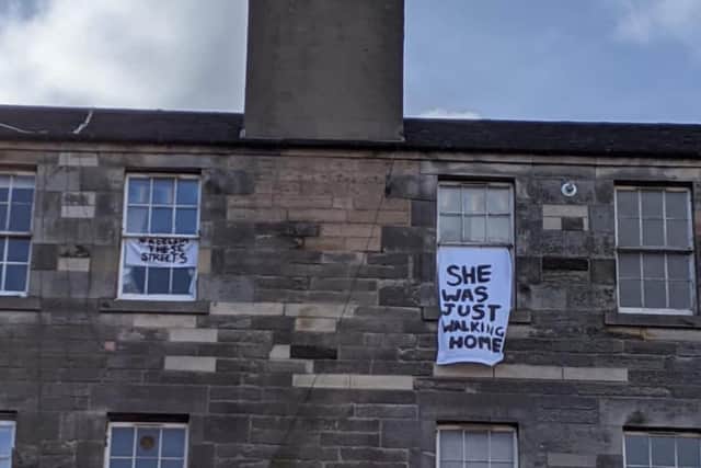 A sign in Edinburgh reading 'She was just walking home' in reference to Sarah Everard.