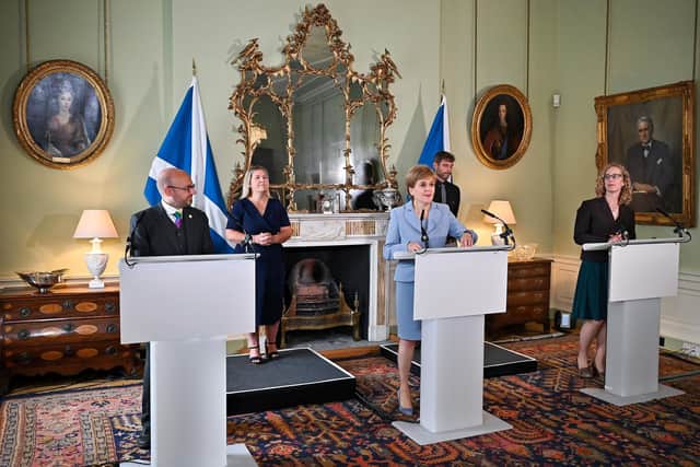 Nicola Sturgeon with Scottish Green party co-leaders Patrick Harvie and Lorna Slater at Bute House, Edinburgh, after they agreed a co-operation deal (Picture: Jeff J Mitchell/PA Wire)