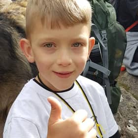 Caeden Thomson, a seven-year-old with cerebral palsy, during his climb to the summit of Ben Nevis for charity on Saturday.