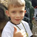 Caeden Thomson, a seven-year-old with cerebral palsy, during his climb to the summit of Ben Nevis for charity on Saturday.