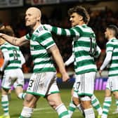 Jota takes delight at Celtic scoring with team-mate Aaron Mooy. (Photo by Alan Harvey / SNS Group)