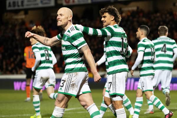 Jota takes delight at Celtic scoring with team-mate Aaron Mooy. (Photo by Alan Harvey / SNS Group)