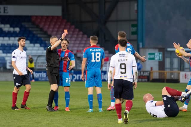Inverness' Scott Allardice is sent off by referee Mike Roncone for a challenge on Charlie Adam during the 1-1 draw. (Photo by Mark Scates / SNS Group)