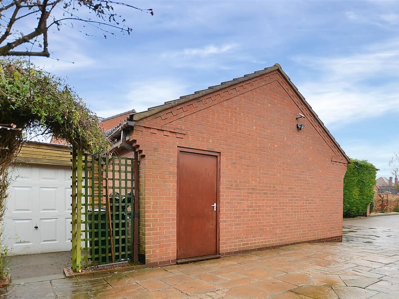 Behind the main garage is an additional garage which is a great storage facility.