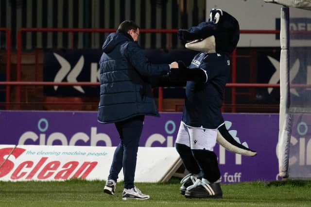 Dundee boss Gary Bowyer shares a moment with mascot SnappyDee. (Photo by Mark Scates / SNS Group)